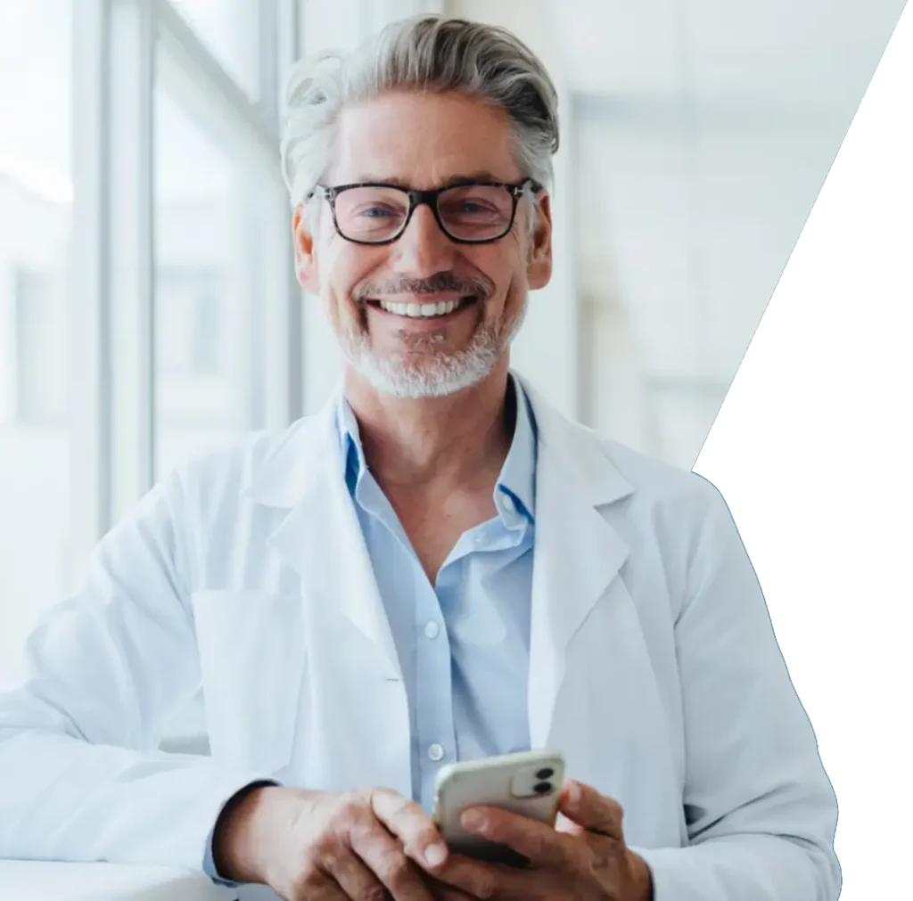 Smiling doctor on mobile phone