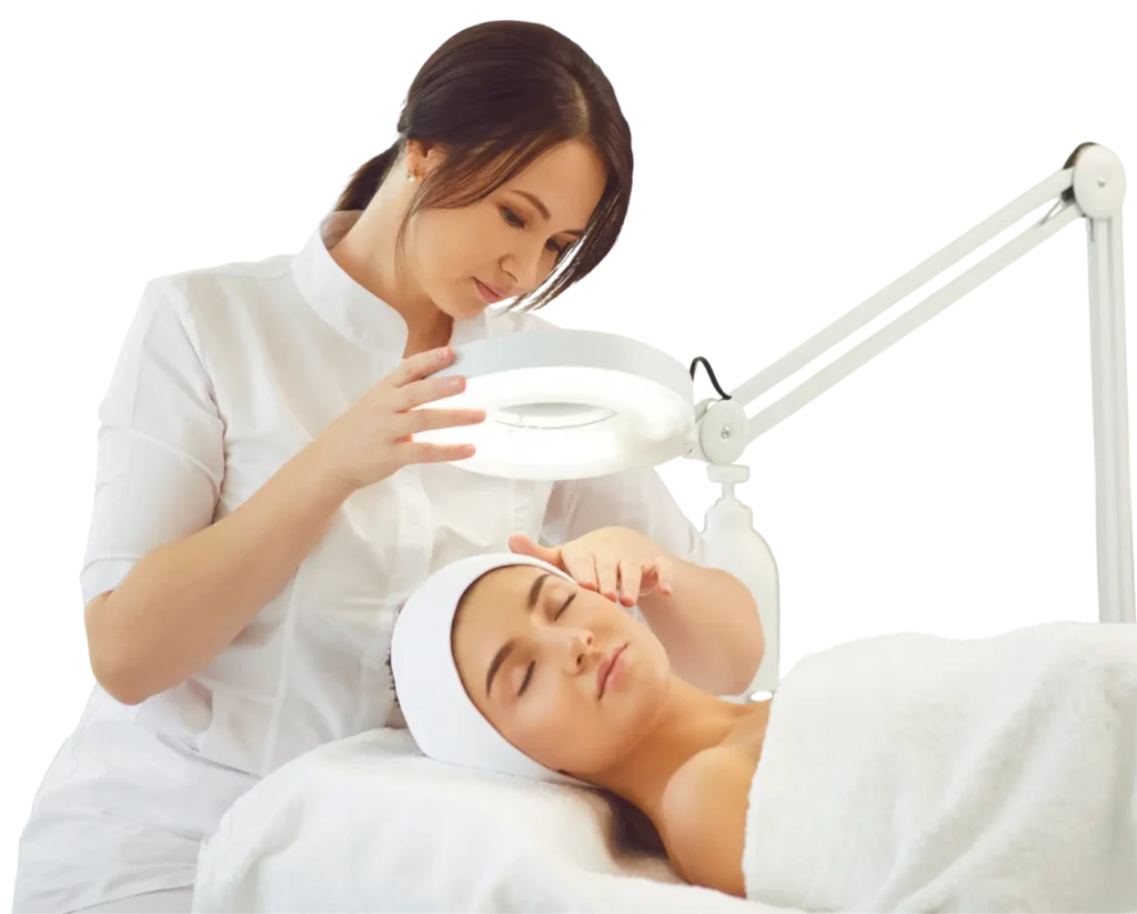 A woman receiving a facial treatment, relaxing on a spa bed with a serene expression and a therapist applying products.